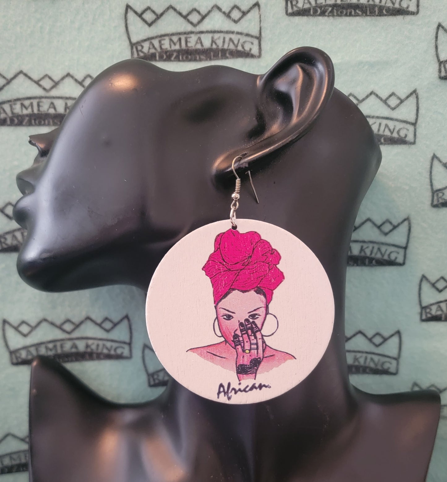 African Lady with Colored Headwrap with Hand to her Face