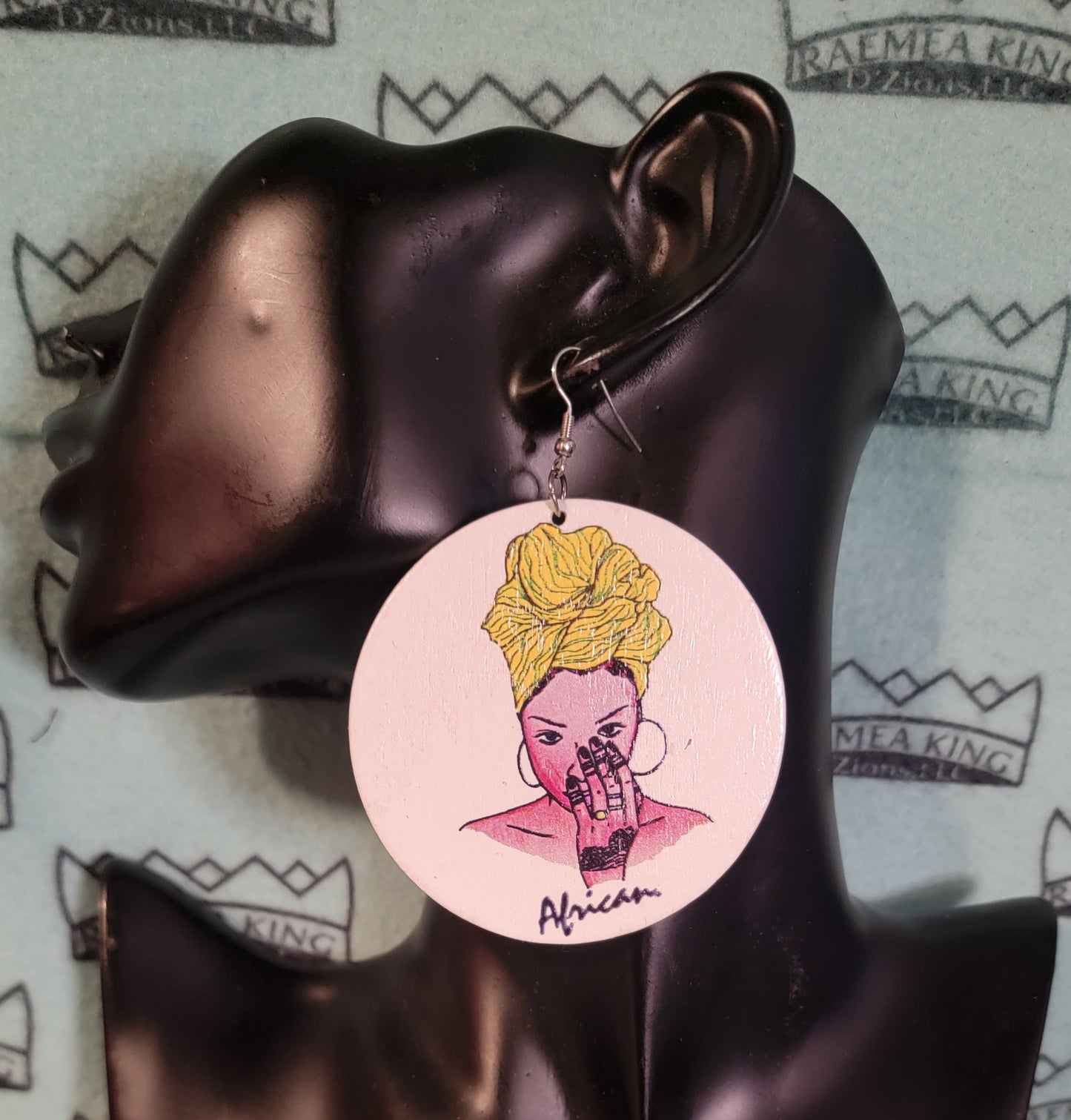 African Lady with Colored Headwrap with Hand to her Face