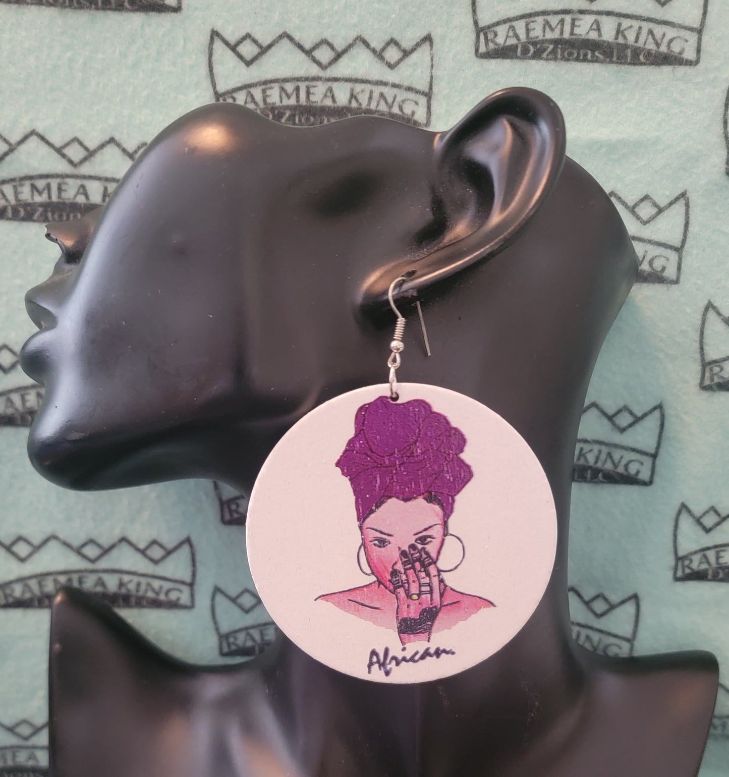 African Lady with Colored Headwrap with Hand to her Face