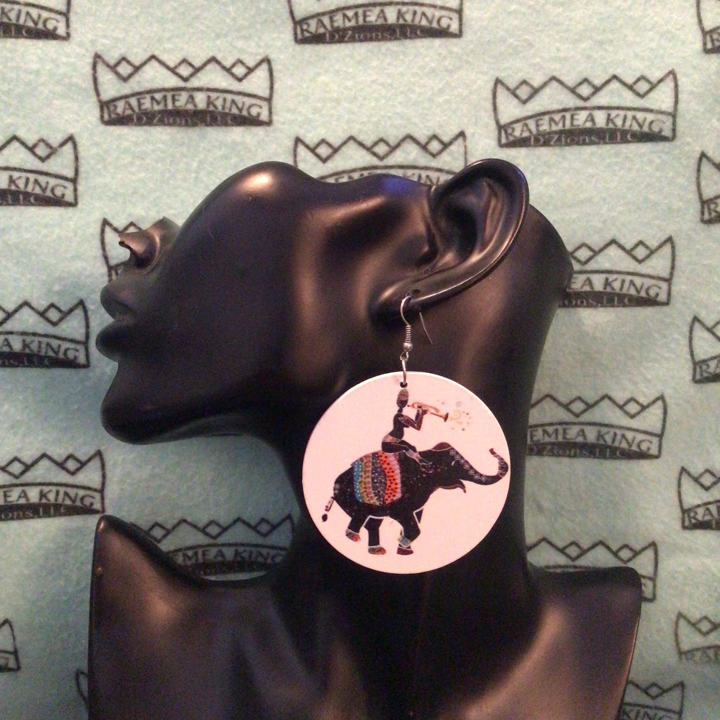 Someone on an Elephant playing a Horn