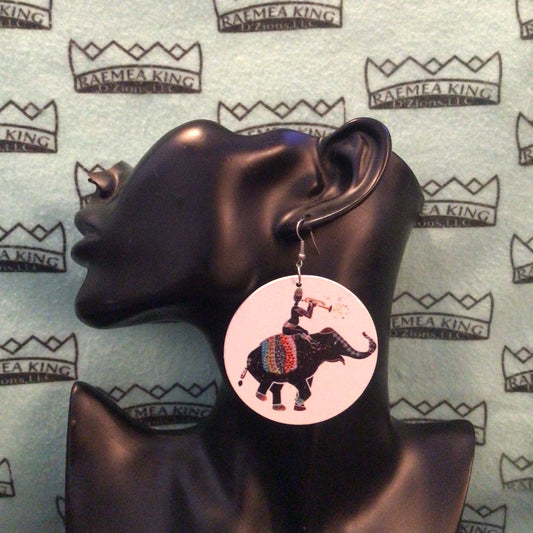 Someone on an Elephant playing a Horn